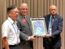 At the IARU Region 3 Conference in Seoul, Korea, ARRL President Rick Roderick, K5UR, presents IARU Region 3 Chairman Gopal Madhavan, VU2GMN (right), and Region 3 Secretary Ken Yamamoto, JA1CJP (left), a plaque recognizing and congratulating IARU Region 3 on its 50th anniversary [Jay Bellows, K0QB, Photo].


